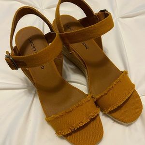 Lucky brand wedge. Size 8. Burnt yellow in color.